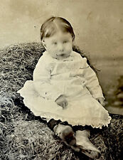 Creepy Early Tintype Photo - Scary Baby on Haystack - Surreal Goth Spooky picture