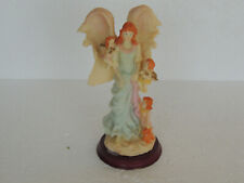 BEUTIFUL ANGEL HOLDING TWO BABY ANGEL ONE HOLDING A BEAR RESIN ON WOOD PEDESTAL picture