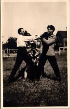 Real Photo Postcard Four Men Playing Around in Field with Boxing Gloves picture