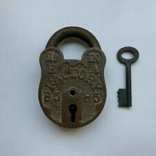An old or antique brass padlock or lock with key collectible carving picture