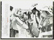 1972 Press Photo Tricia Cox tries on political banner at Miami airport. picture