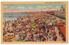 Ocean City New Jersey c1940's crowded beach scene, umbrellas, boardwalk picture