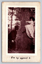 1915 Antique Postcard I'm Up Against It Man Admires Woman Straddling Big Tree picture
