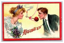 Postcard Halloween Tuck's # 174 Romance Man and Woman Apple Bobbing picture