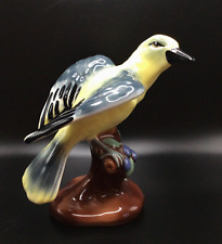 Vintage Yellow Bird warbler Figurine with Open Wings on Tree Stump picture