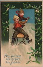 1910s CHRISTMAS Postcard Boys Snow Sledding 