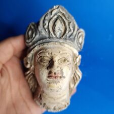 A GANDHARAN STUCCO PAINTED HEAD OF A WORSHIPPER picture