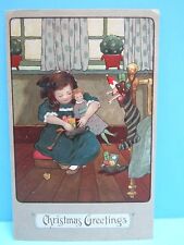 VTG 1900's NOS - EMBOSSED  PC - YOUNG GIRL OPENING GIFTS ON CHRISTMAS GERMANY picture
