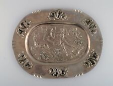 Swedish designer. Large oval serving dish in metal with classicist hunting scene picture
