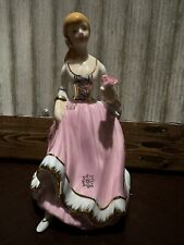 Beautiful Porcelain figurine lady holding flower in pink dress w/gold trim picture