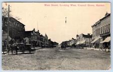 1912 COUNCIL GROVE MAIN STREET LOOKING WEST DIRT ROAD HORSES WAGON POSTCARD picture