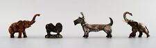 Four miniature figures in various metals, early 1900s. picture