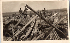 WW1 soldiers standing amoung ruins RPPC postcard a20 picture