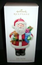 2010 Hallmark ~JOLLY OLD ELF ~ Santa Fills Stocking With Toys New/NMB picture