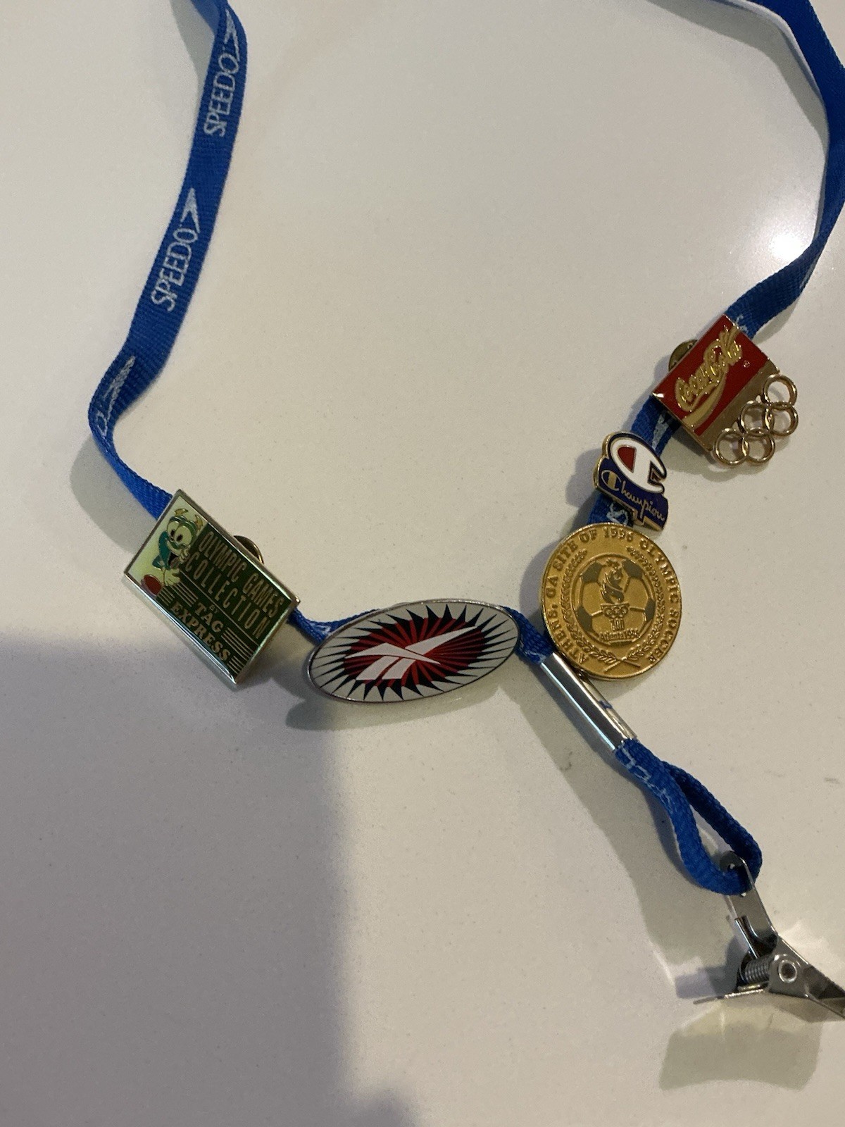 Vintage 1996 Atlanta Olympic Games collectible pin lot with Speedo lanyard. Vintage 1996 Atlanta Olympic Games collectible pin lot with Speedo lanyard.