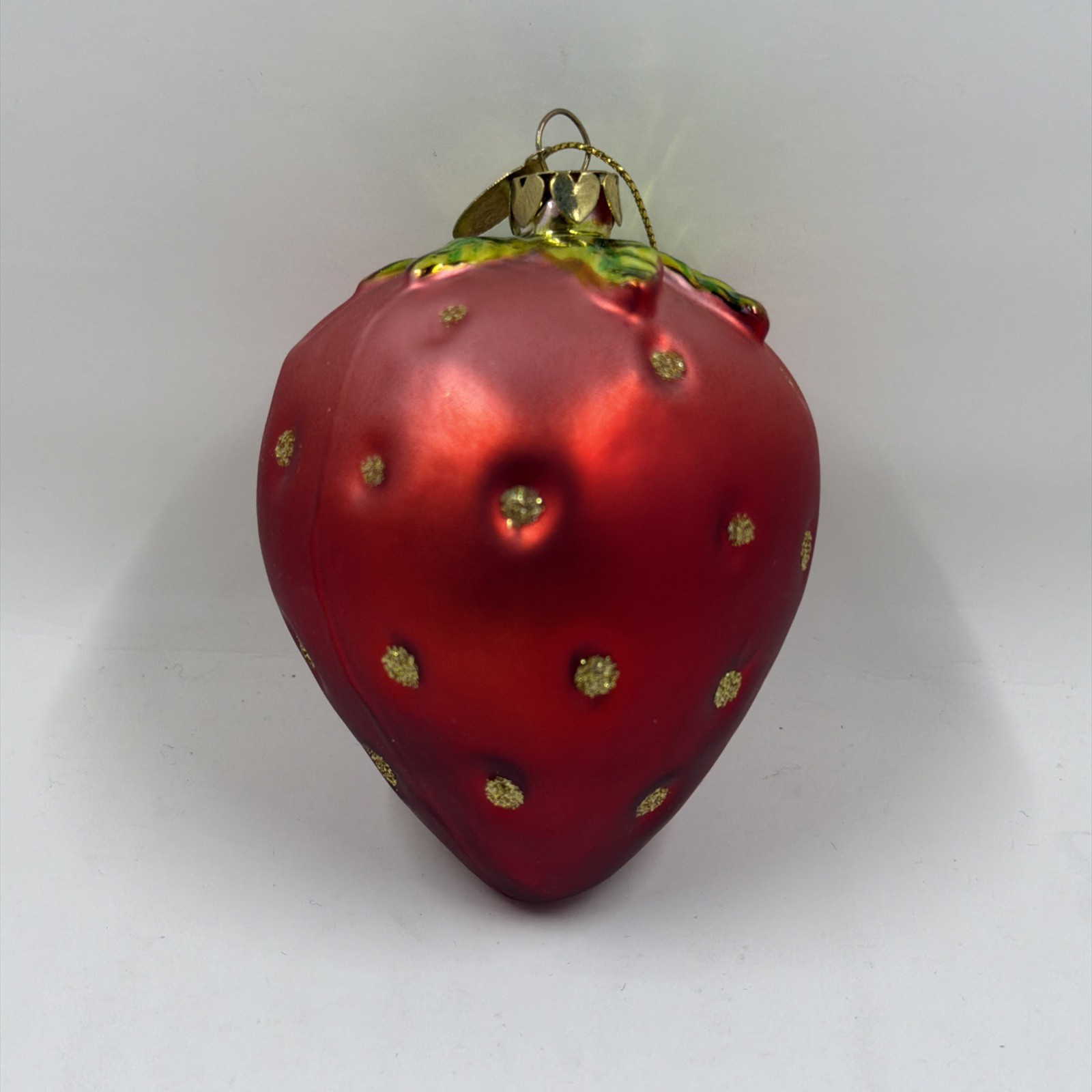 Juicy Couture glass strawberry Christmas ornament.