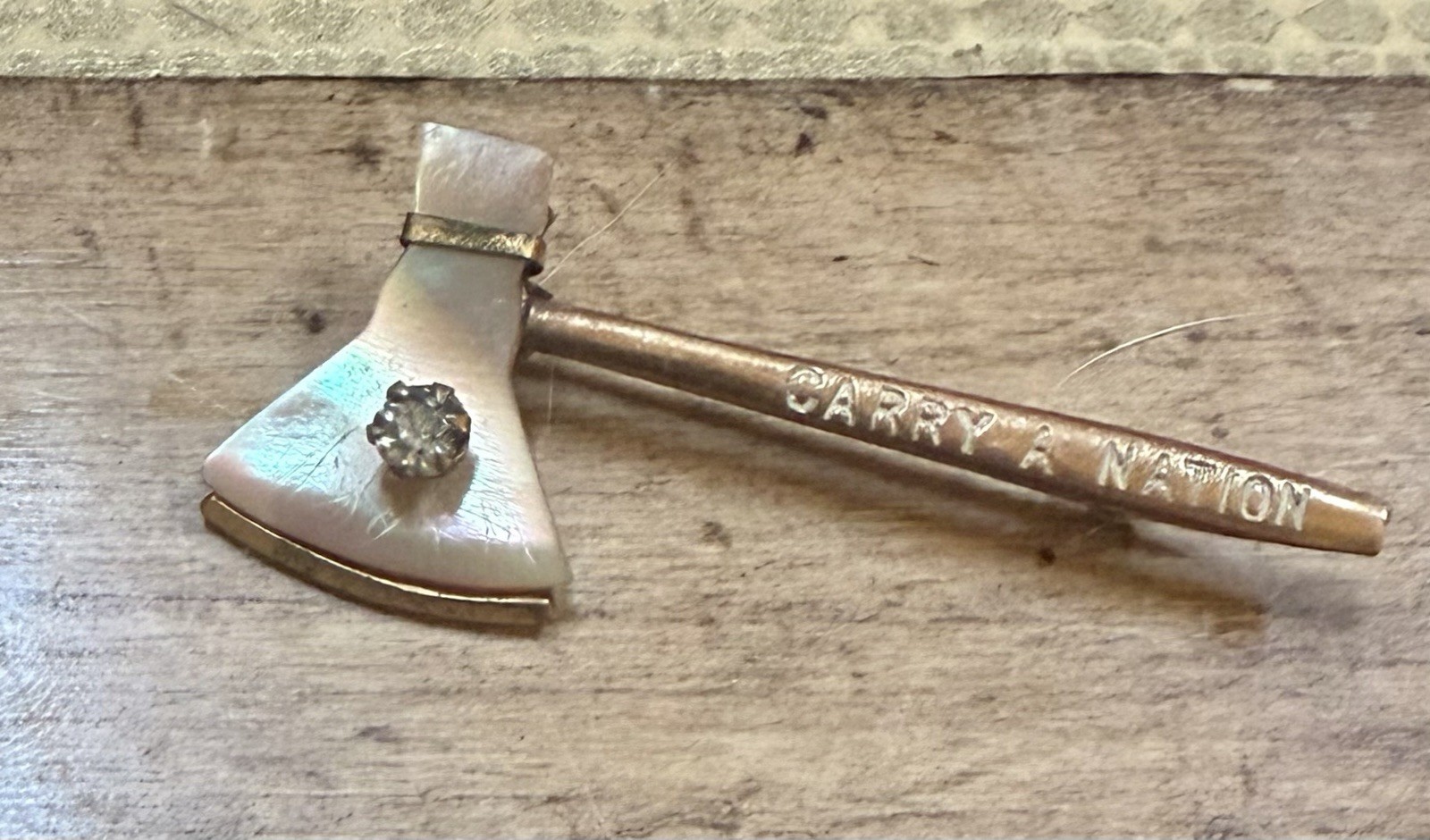Carrie A. Nation Temperance Movement Hatchet Pin-1905-Mother-of-Pearl & Saphiret Carrie A. Nation Temperance Movement Hatchet Pin-1905-Mother-of-Pearl & Saphiret