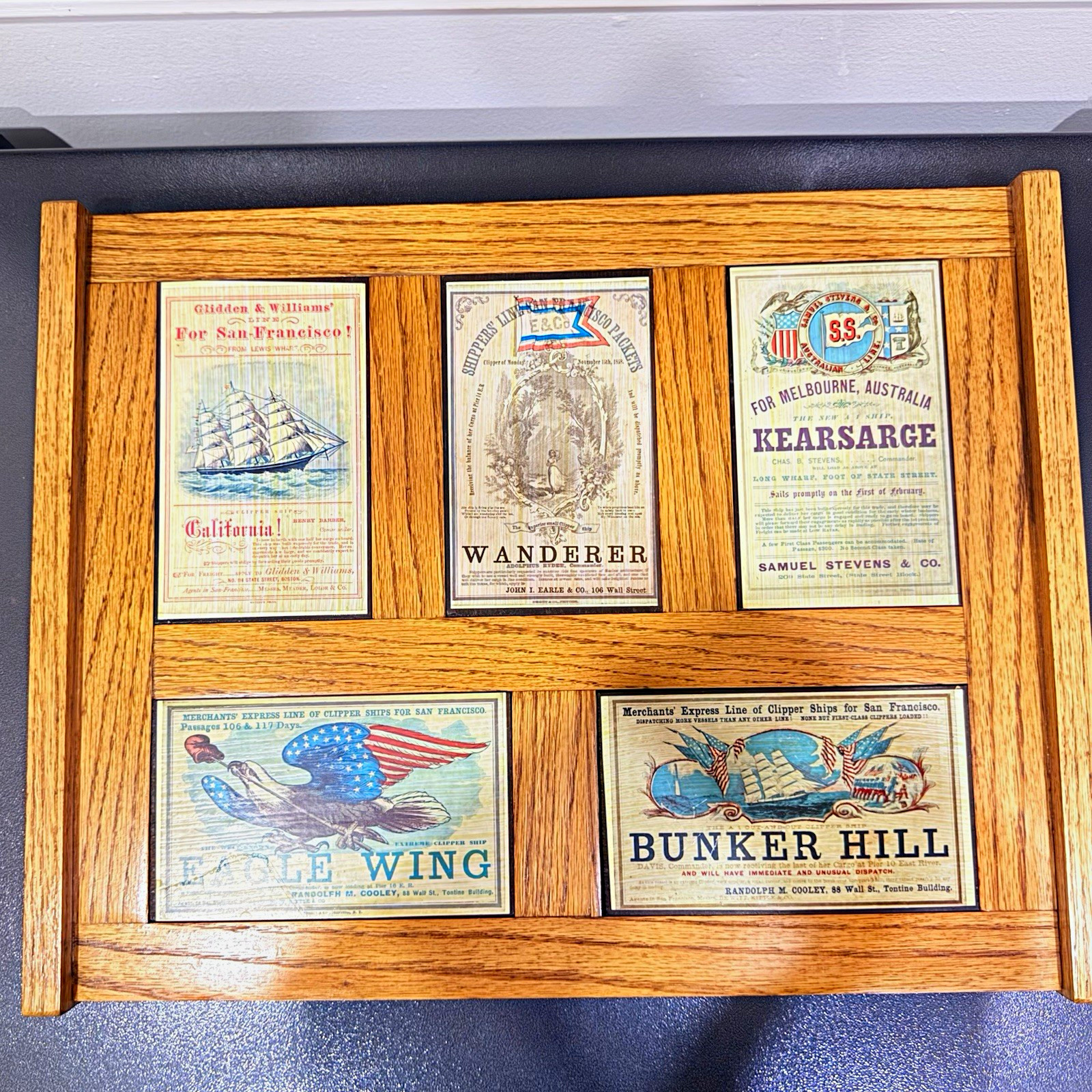 Vintage wall art 19th-century clipper ship ads on a handcrafted wood frame. Vintage wall art 19th-century clipper ship ads on a handcrafted wood frame.