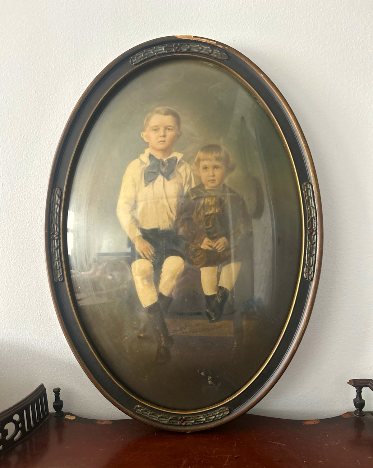 Antique oval picture frame with convex glass, containing a Victorian pastel port Antique oval picture frame with convex glass, containing a Victorian pastel port