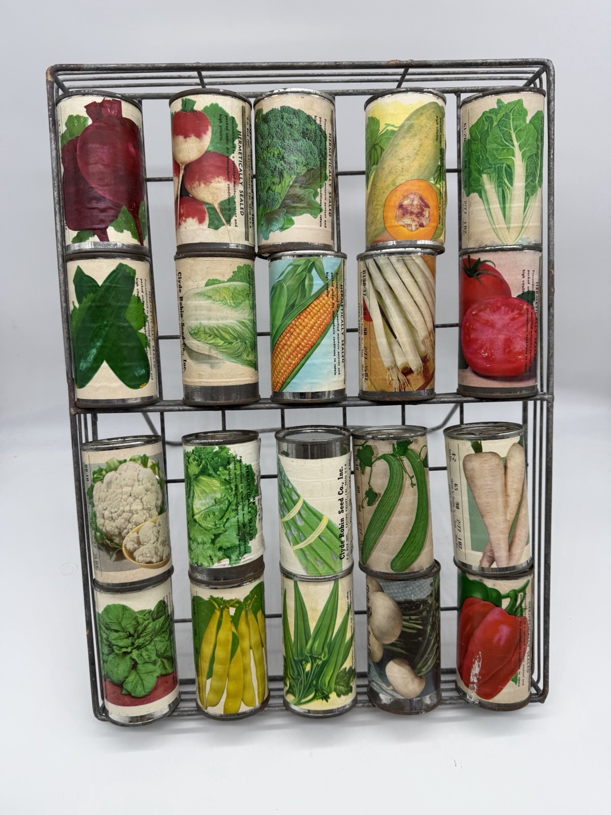 1930’s Clyde Robin Seed Tin Can Collection & Rack (20 Sealed Cans)