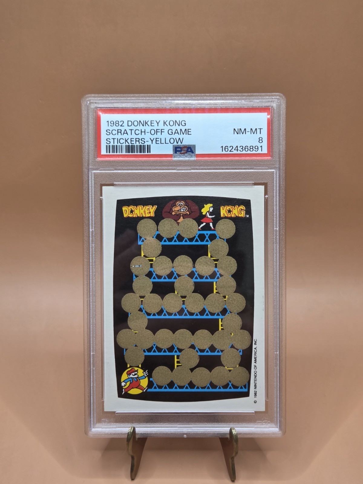 1982 Donkey Kong Scratch-Off Game Stickers Yellow PSA 8 1982 Donkey Kong Scratch-Off Game Stickers Yellow PSA 8