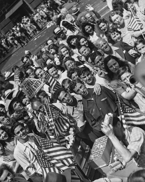 High angle view revellers one holding a newspaper headline Complet- Old Photo High angle view revellers one holding a newspaper headline Complet- Old Photo