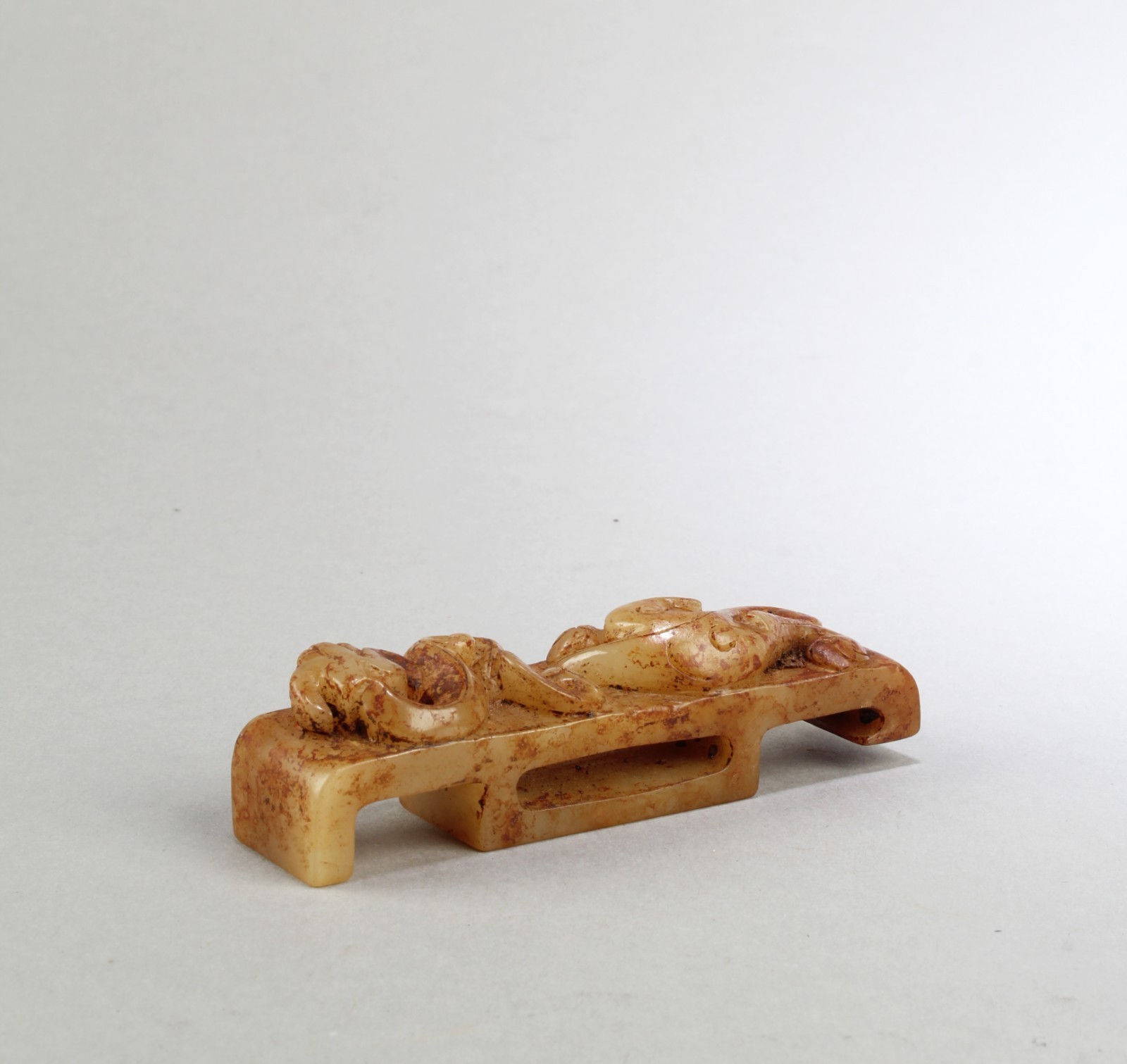 A Carved Jadestone Belt Hook A Carved Jadestone Belt Hook