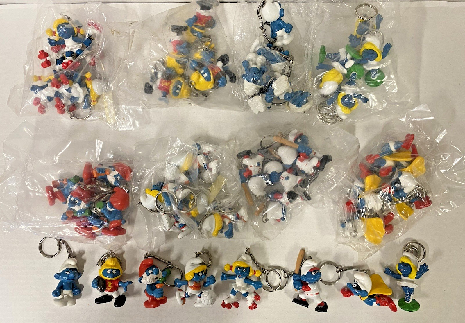 Wholesale 48 Vintage 1980's Smurf PVC Figure Keychains 8 different Wholesale 48 Vintage 1980's Smurf PVC Figure Keychains 8 different