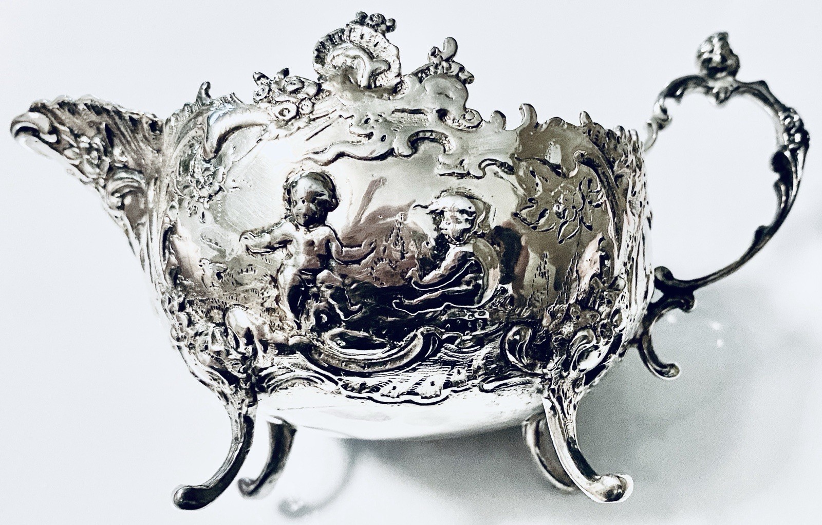 SALE Antique 1800’s of a RARE Linton Silver Creamer. Detailed Cherubs and Body.
