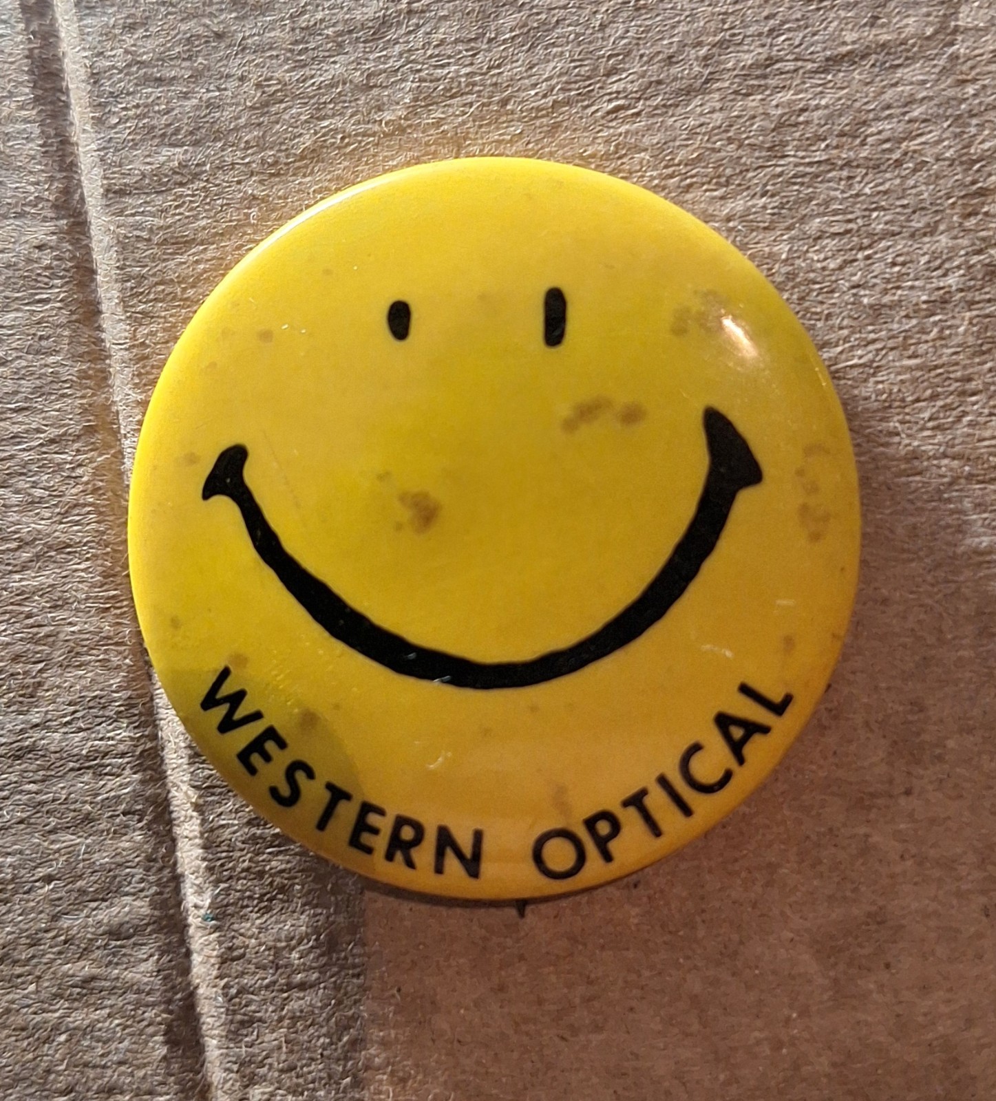 vintage yellow smiley face pinback button custom-printed for Western Optical vintage yellow smiley face pinback button custom-printed for Western Optical