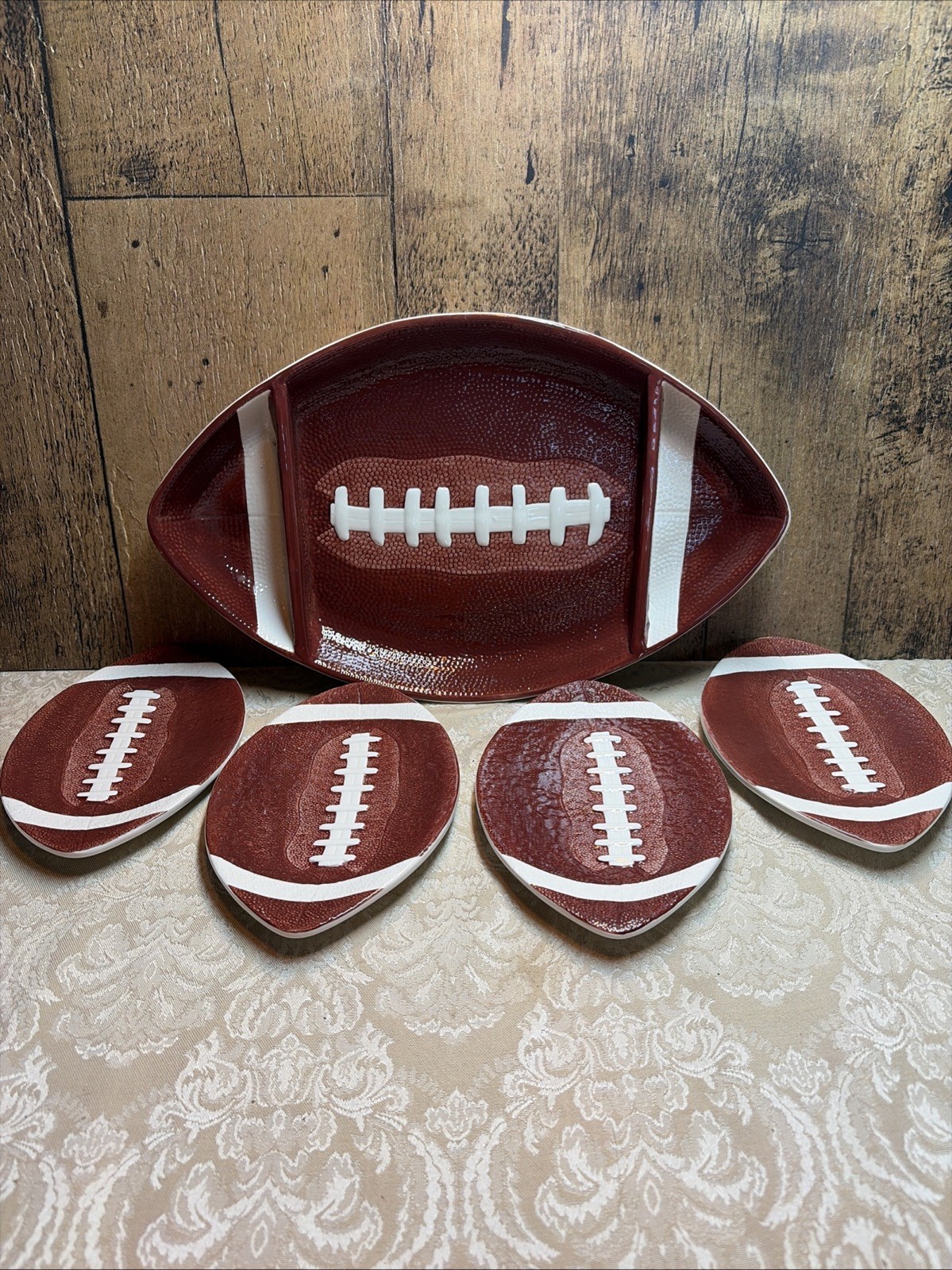 Football Snack Platter and (4) plates. Ceramic. 2004 Boston Warehouse Trading Co Football Snack Platter and (4) plates. Ceramic. 2004 Boston Warehouse Trading Co