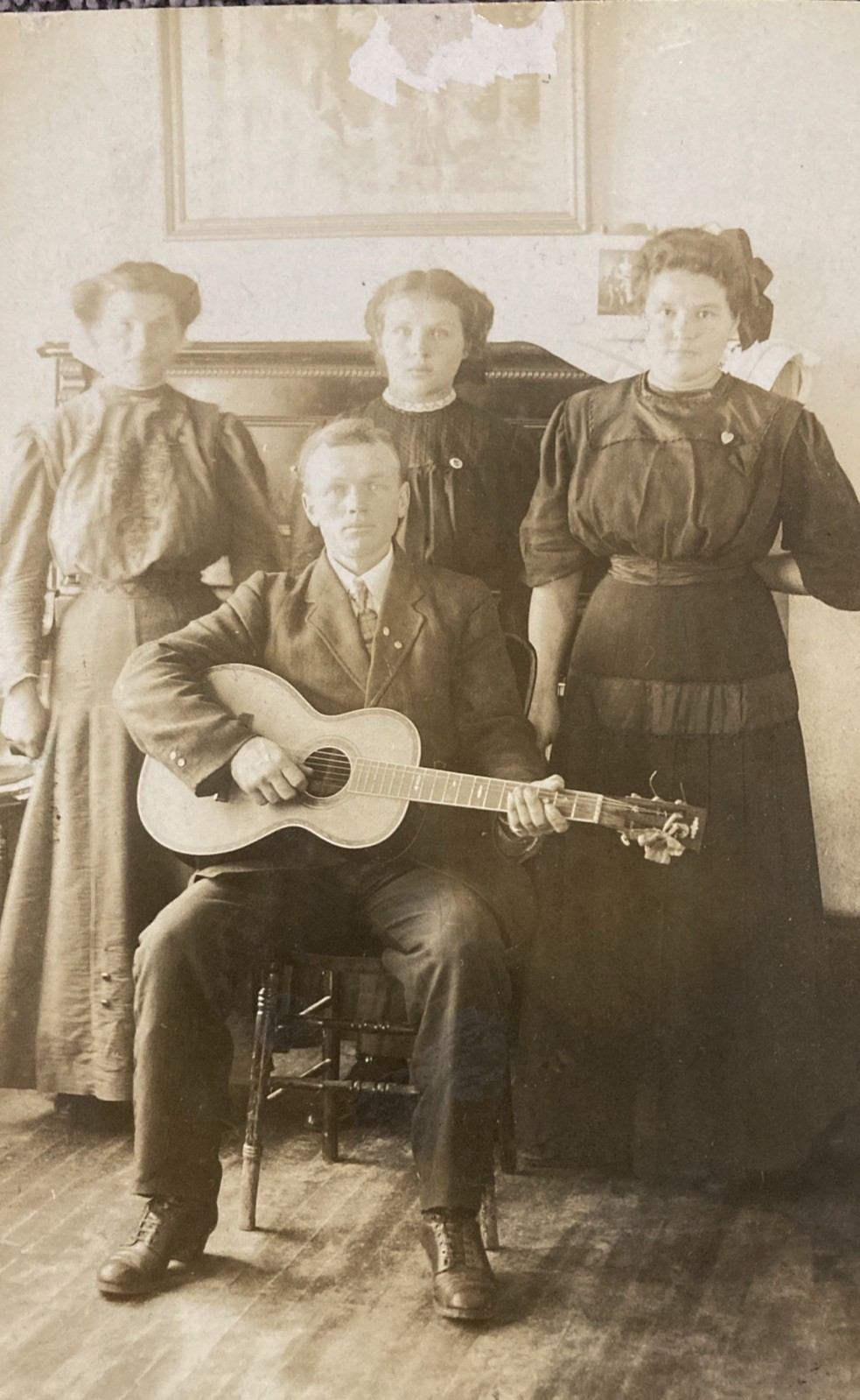 RPPC Family Of Musicians Man With Guitar And Piano In Background Postcard RPPC Family Of Musicians Man With Guitar And Piano In Background Postcard