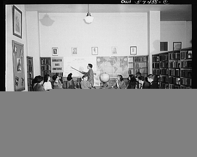 Librarian Teaching Students World Map Classroom 1910s Library Interior