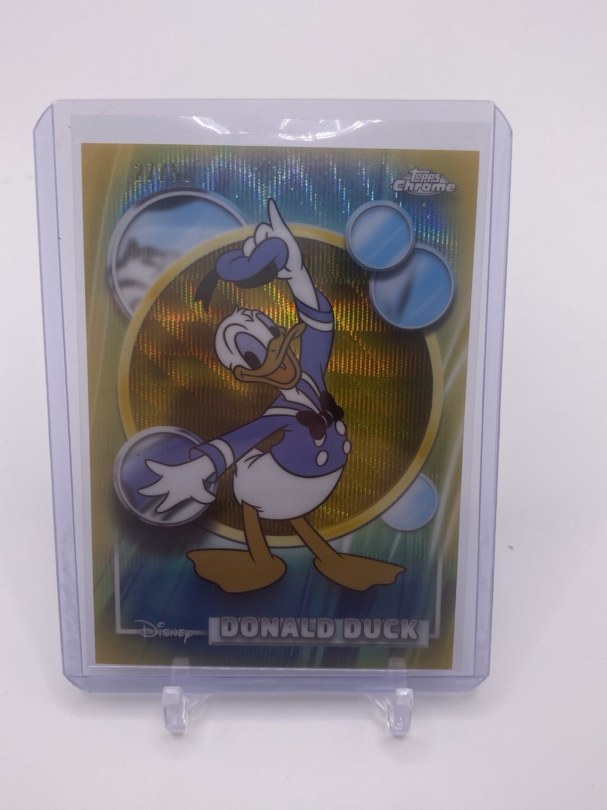2026 Topps Chrome Disney Donald Duck #99 Gold Refractor #27/50 2026 Topps Chrome Disney Donald Duck #99 Gold Refractor #27/50