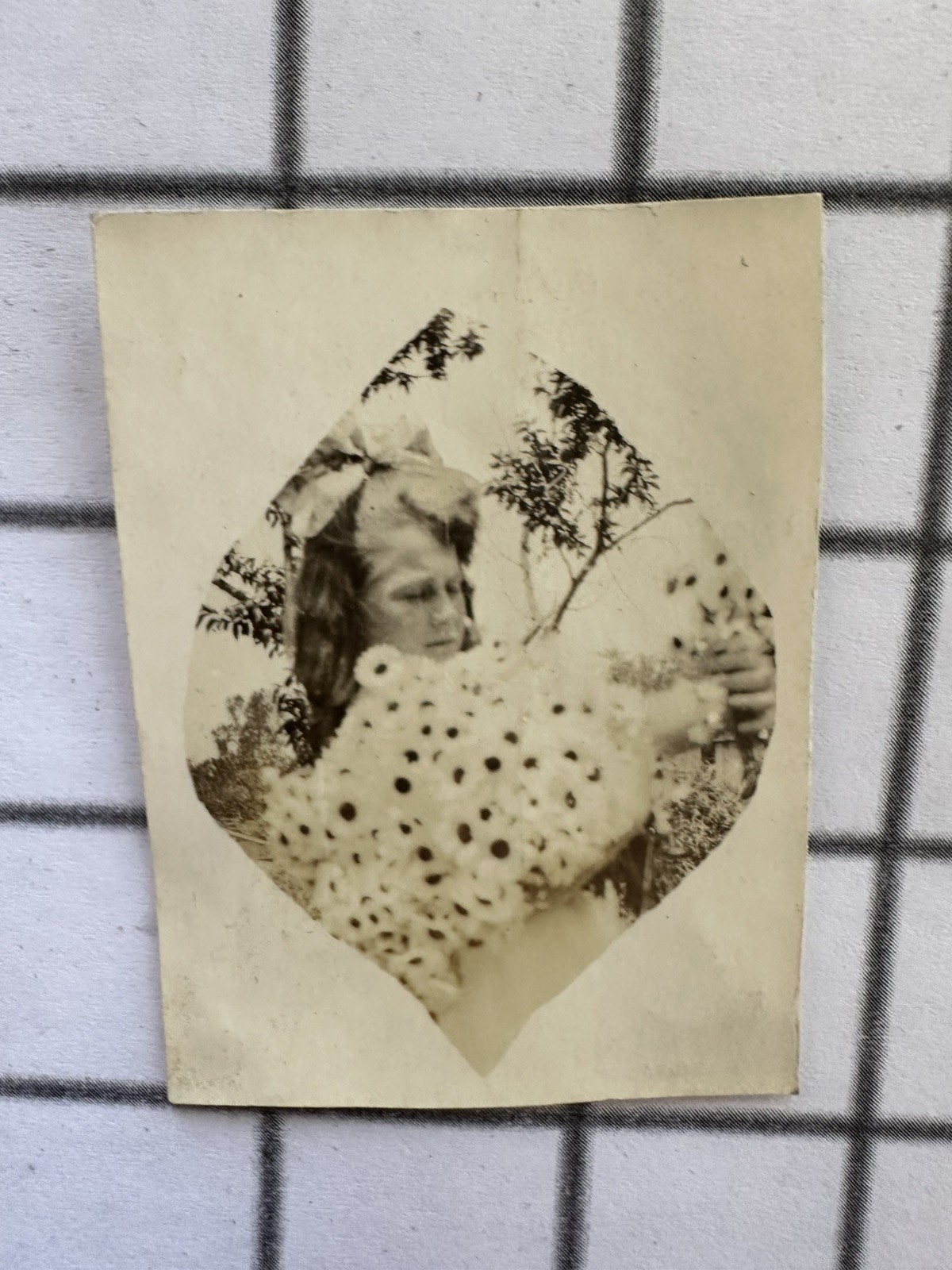 Antique 1910s Girl Huge Hair Bow Holding Daisies Heart-Shaped Snapshot