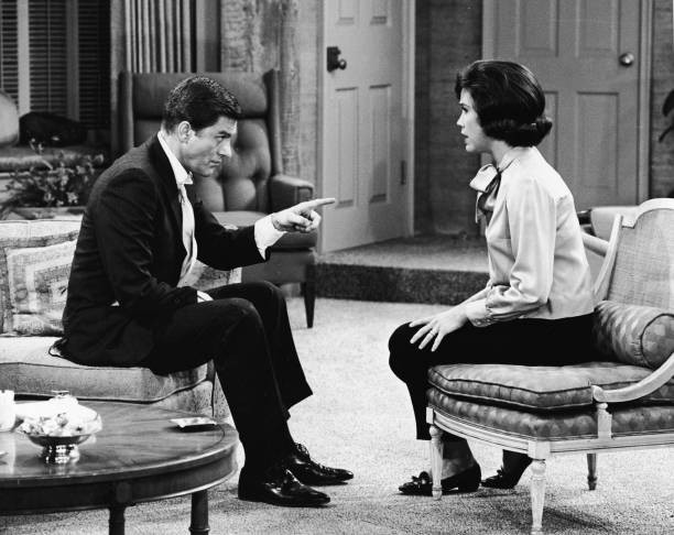 American actor Dick Van Dyke sits a couch points American actor Ma- Old Photo American actor Dick Van Dyke sits a couch points American actor Ma- Old Photo
