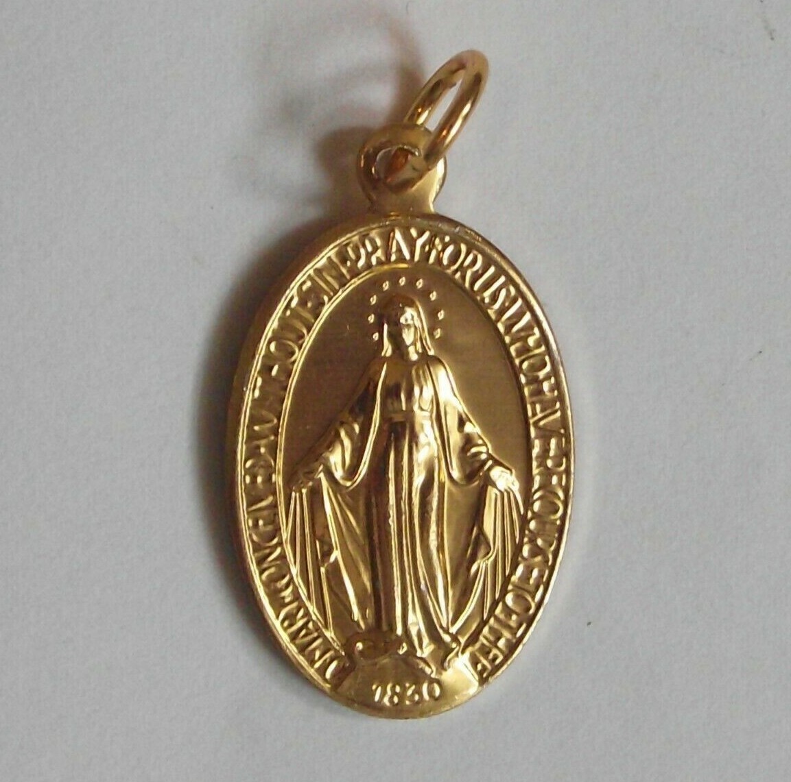 Vintage nos gold tone aluminum Miraculous Virgin Mary oval medal Italy 15x26mm