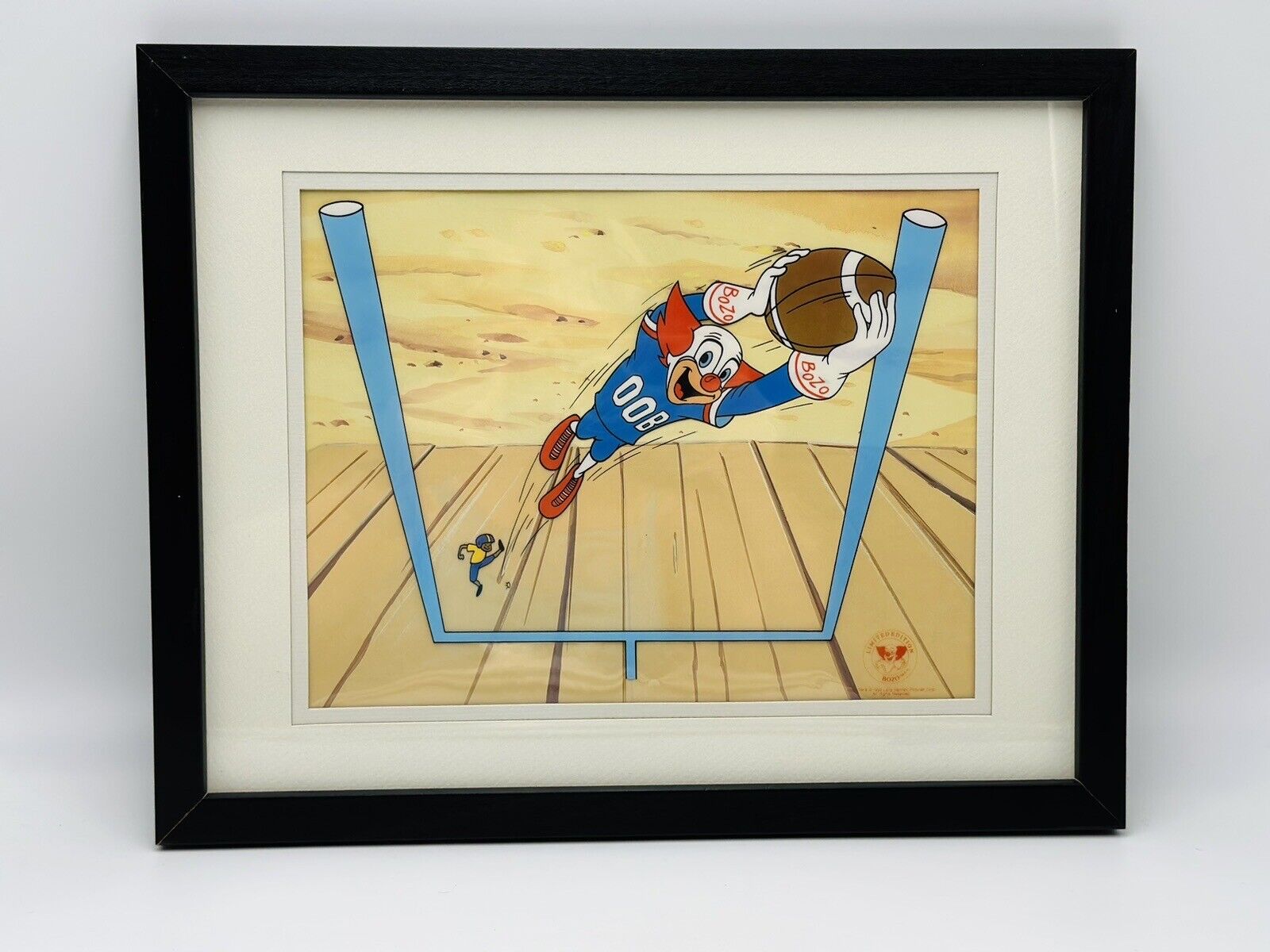 BOZO THE CLOWN Playing FOOTBALL LE 15x12” Serigraph Cel Framed Picture