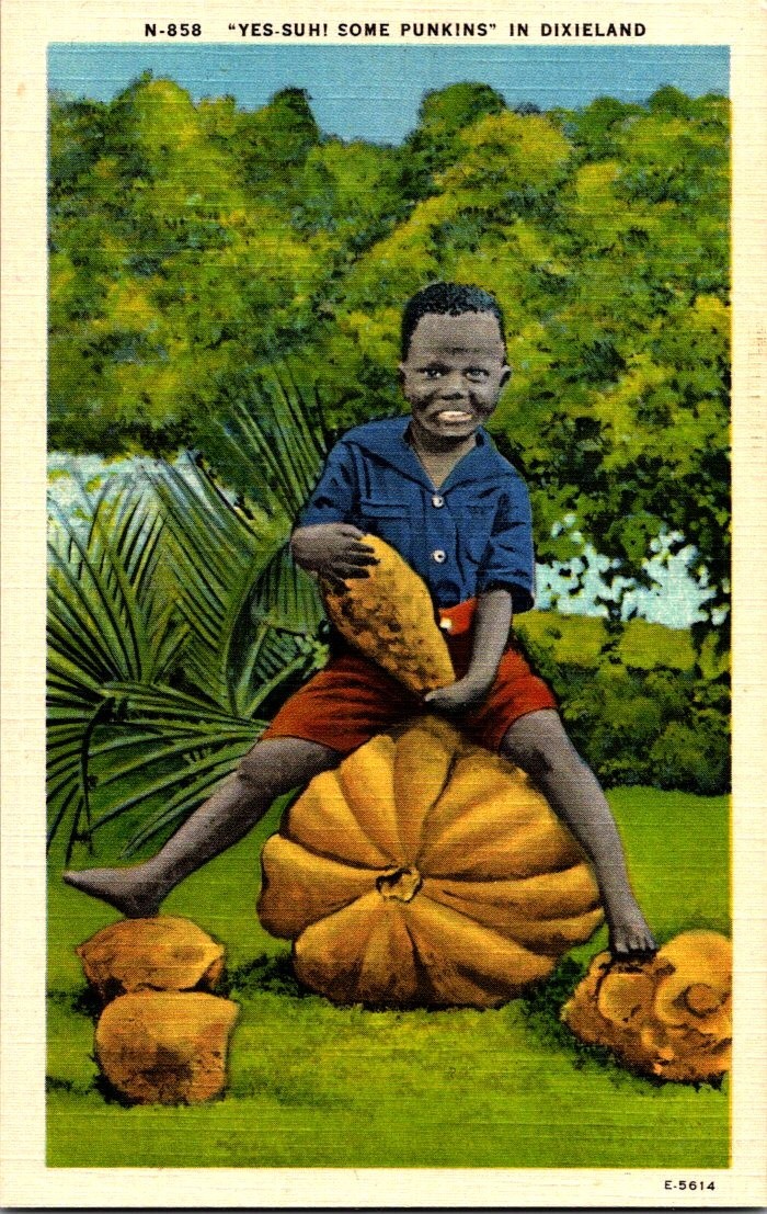 Young African American boy on Pumpkin in Dixieland Vintage Linen Postcard