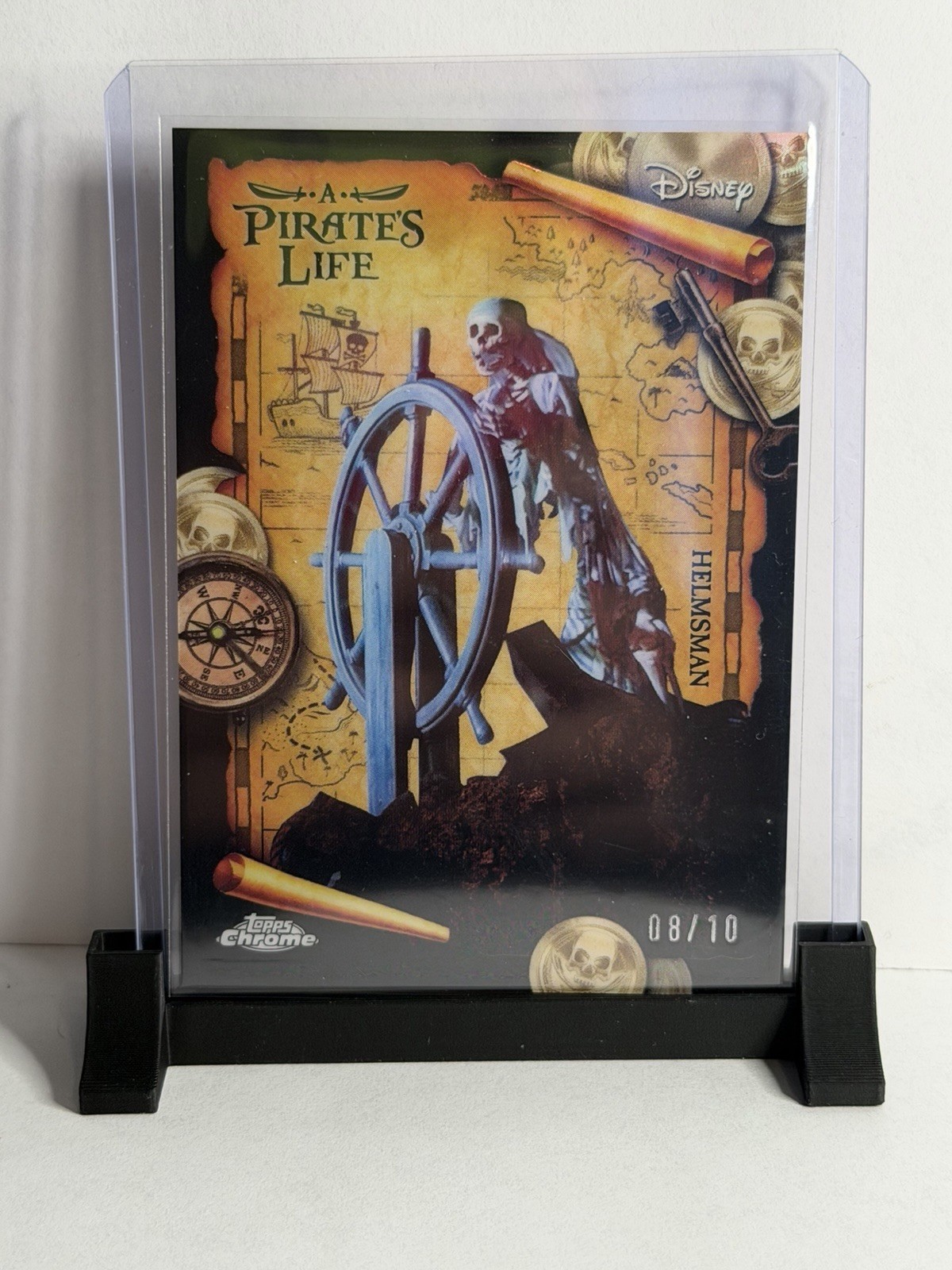 2025 Topps Disney 70th Helmsman Black 8/10 A Pirates Life Chrome SSP 2025 Topps Disney 70th Helmsman Black 8/10 A Pirates Life Chrome SSP