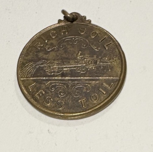 1890s RICH SOIL-LESS TOIL INTERNATIONAL HARVESTER CO I.H.C. SPREADER TOKEN Medal 1890s RICH SOIL-LESS TOIL INTERNATIONAL HARVESTER CO I.H.C. SPREADER TOKEN Medal