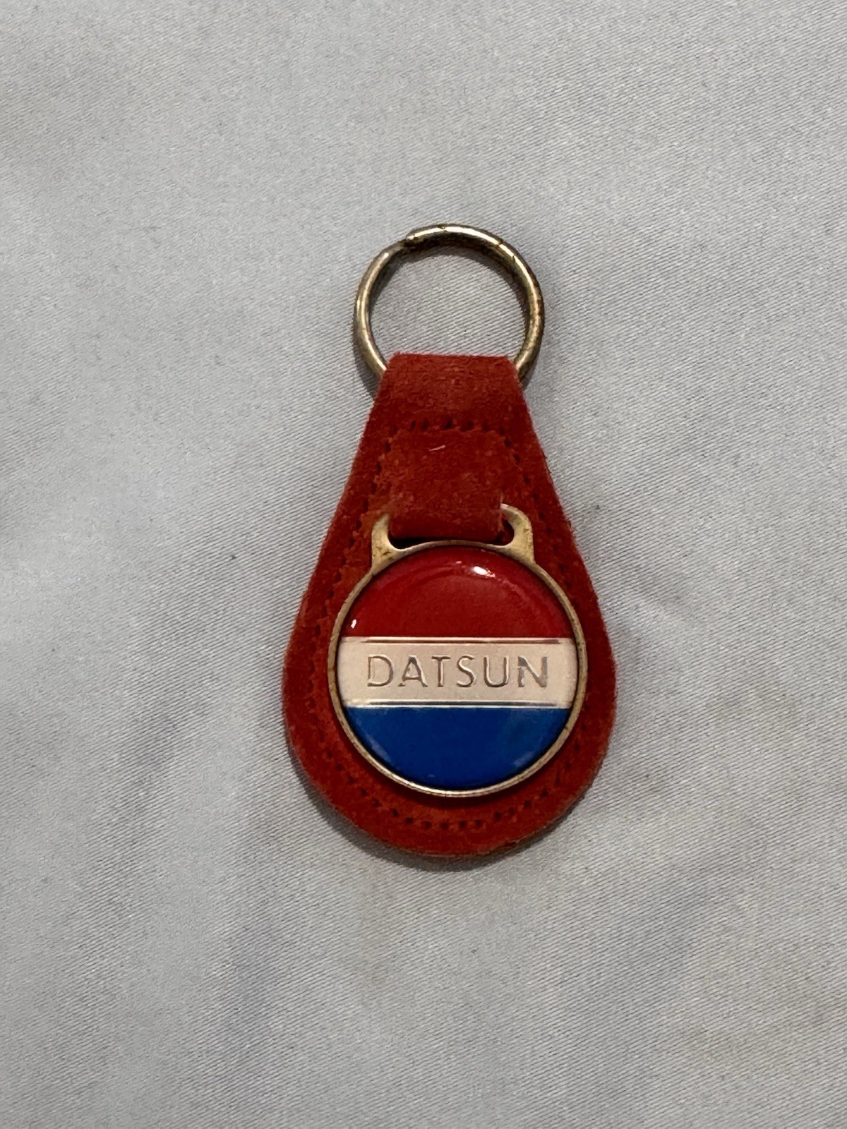 Vintage 1970’s Datson Keychain On Leather, Used In Good Condition Vintage 1970’s Datson Keychain On Leather, Used In Good Condition