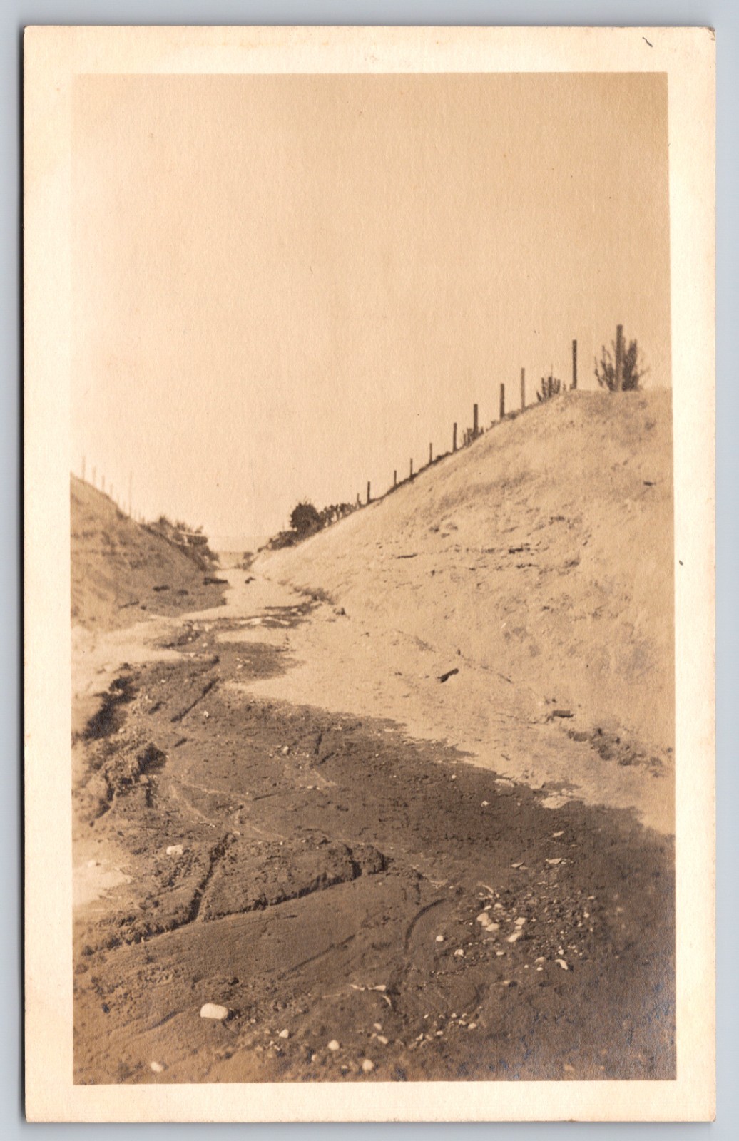 Dirt Road Tracks Running Through Deep Earthen Cut With Fence On Ridge Scene RPPC Dirt Road Tracks Running Through Deep Earthen Cut With Fence On Ridge Scene RPPC