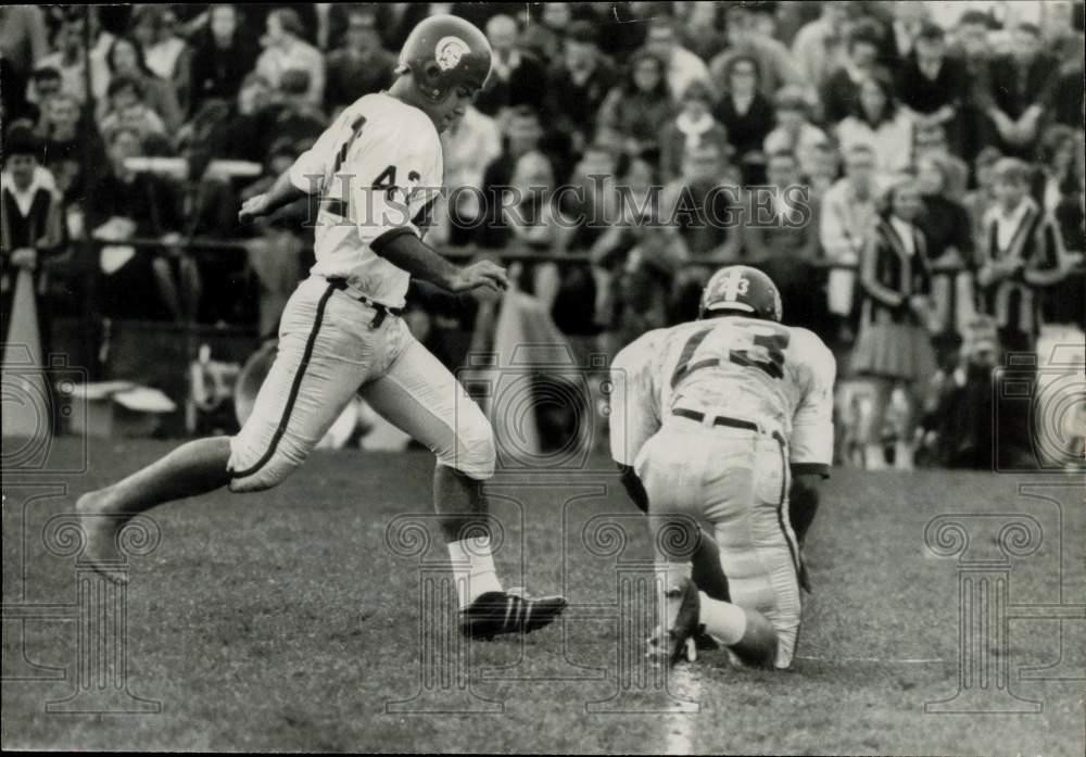 1965 Press Photo Football players on the field watched by spectators during game 1965 Press Photo Football players on the field watched by spectators during game