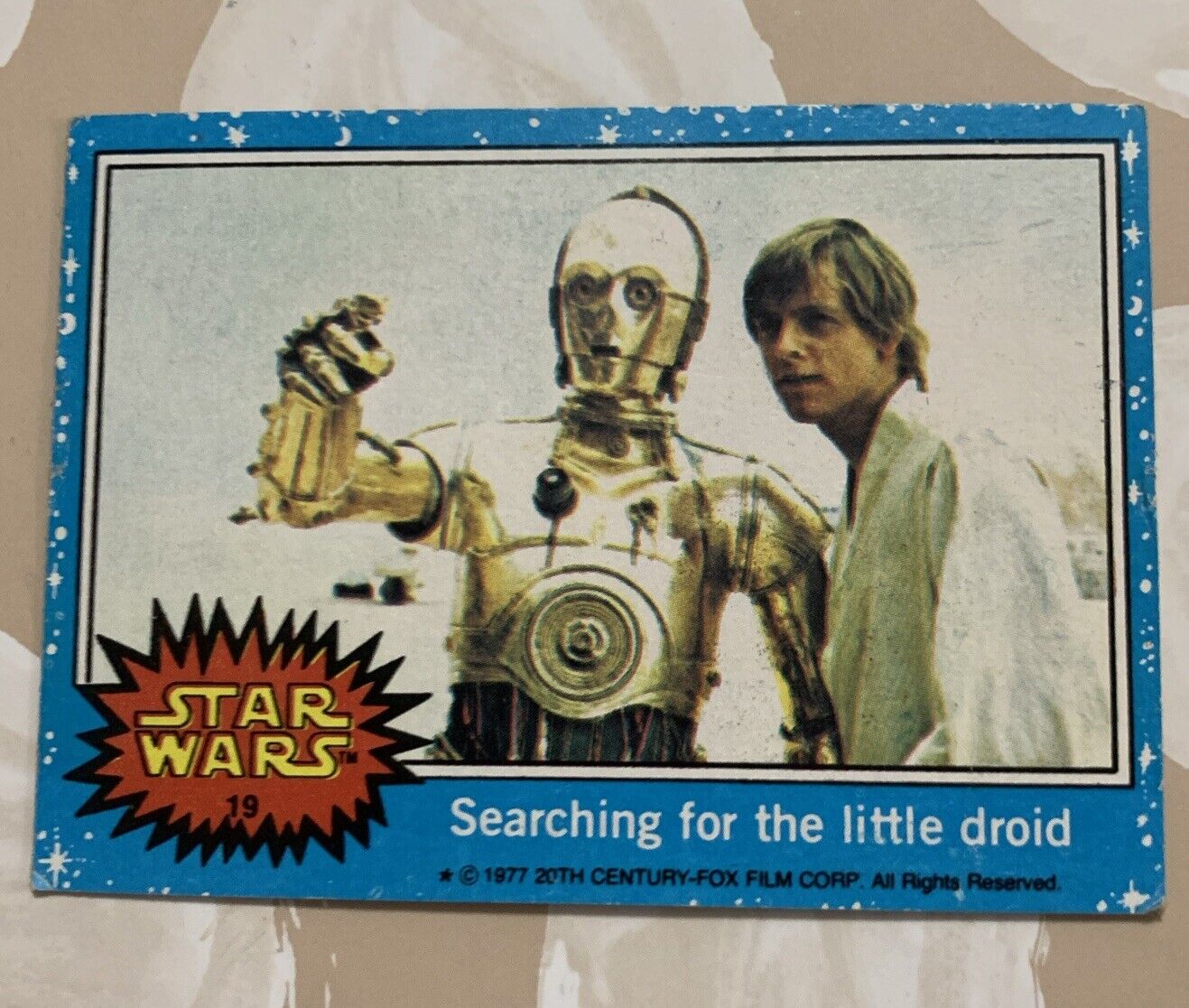 1977 Topps Star Wars Series 1 Blue “Searching For The Little Droid” Card #19