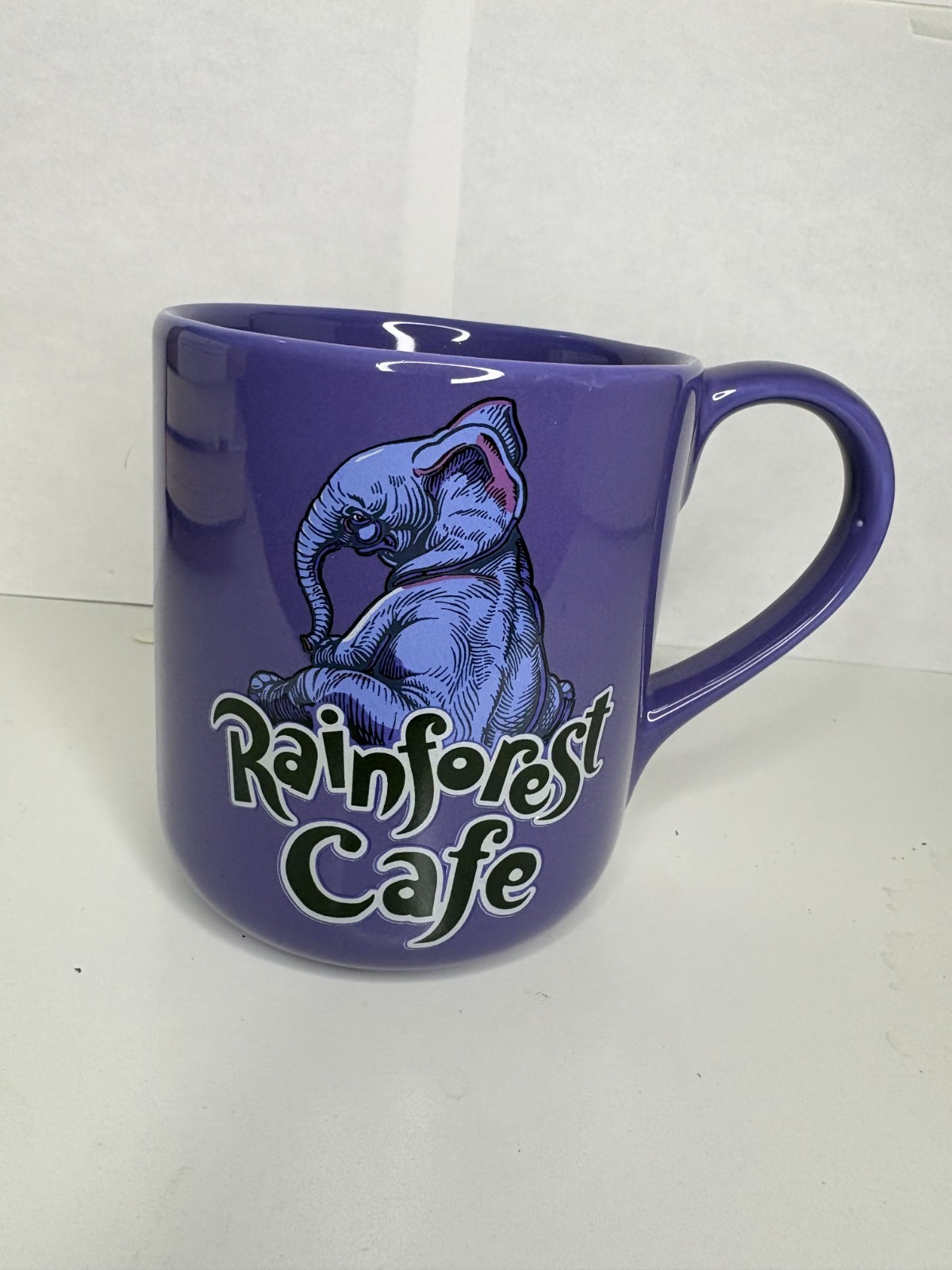 Rainforest Cafe Tuki Elephant Purple Coffee Mug 16 oz Ceramic 1999 Rainforest Cafe Tuki Elephant Purple Coffee Mug 16 oz Ceramic 1999