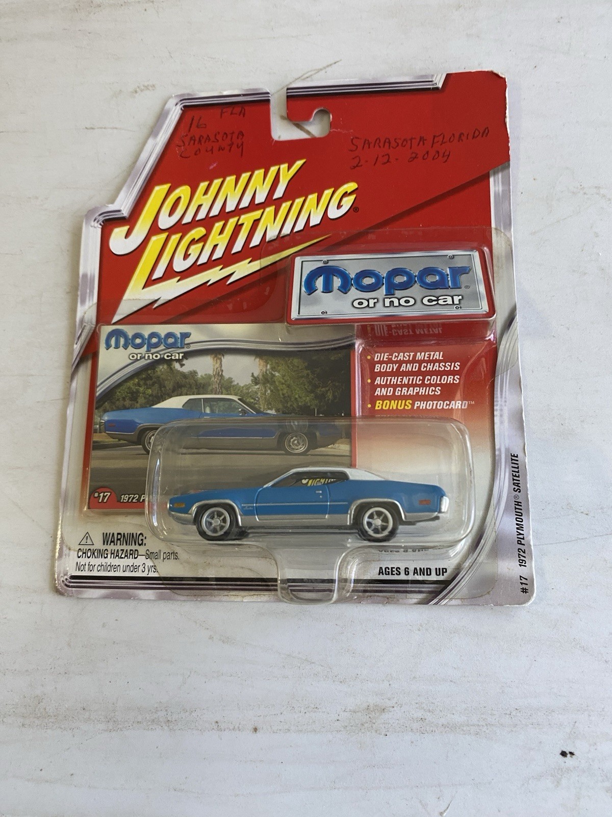 JOHNNY LIGHTNING  1/64  1972 PLYMOUTH SATELLITE   writing on front of package