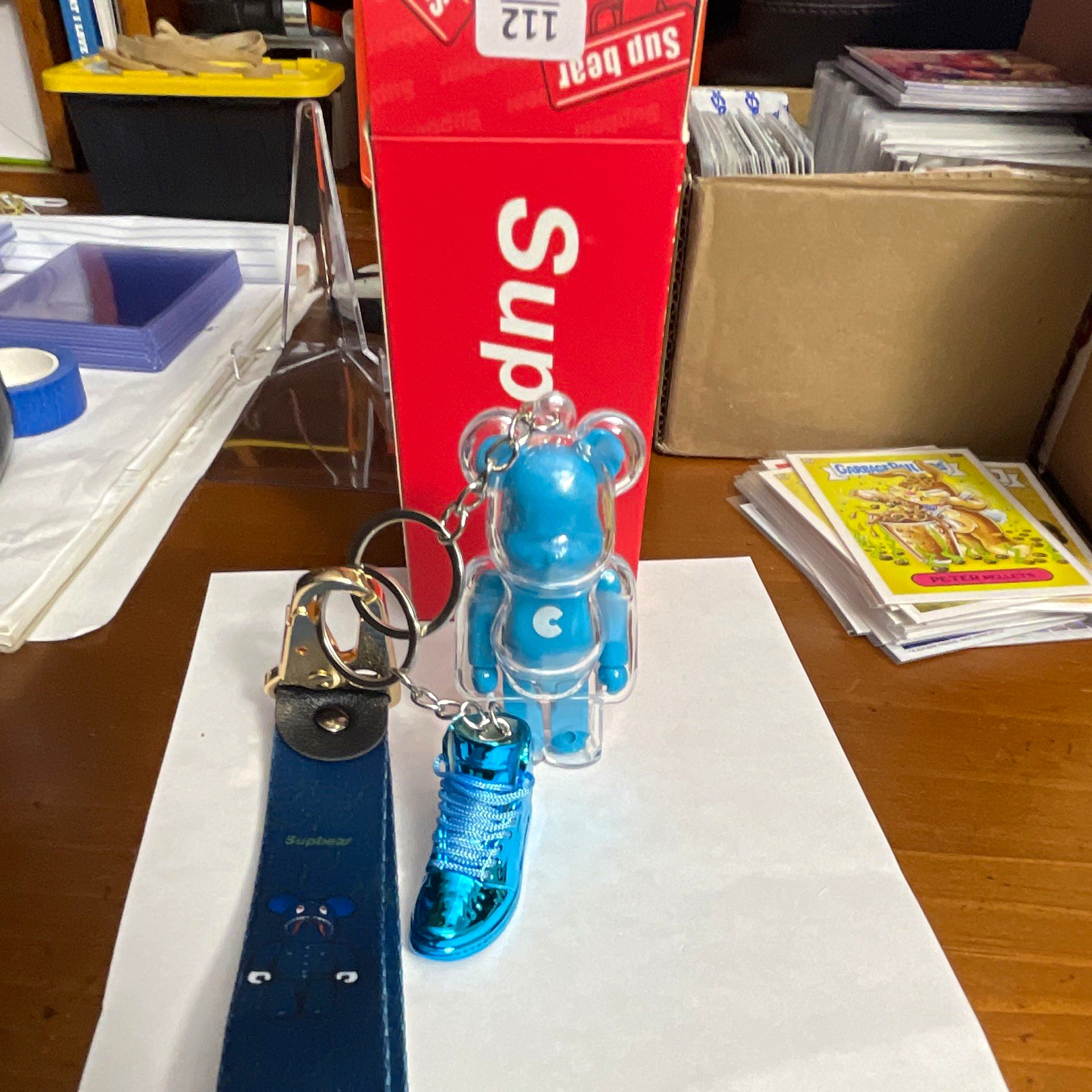 Supbear Bearbrick-Style Bear Figure Keychain w/ Metallic Blue Sneaker Charm Supbear Bearbrick-Style Bear Figure Keychain w/ Metallic Blue Sneaker Charm