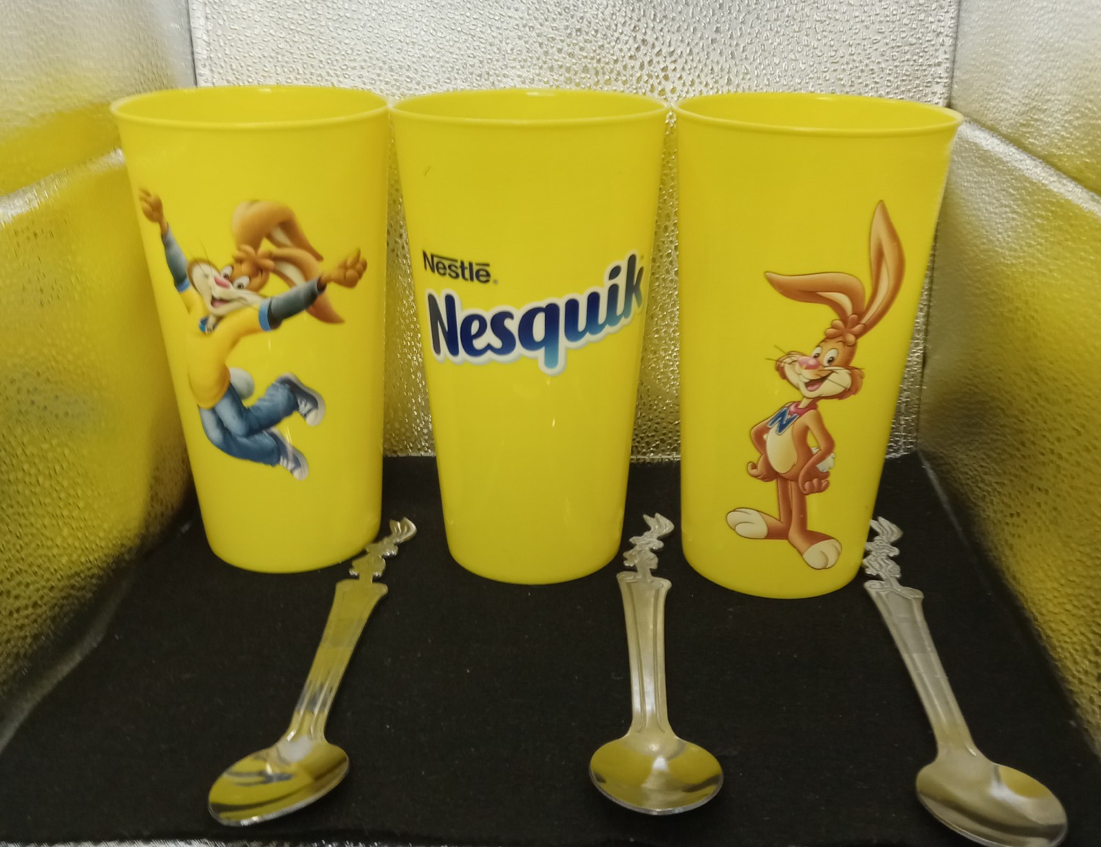 Set of 3 Nestle Quik Bunny Rabbit Stainless Spoons W/ 24oz Nesquik plastic cups. Set of 3 Nestle Quik Bunny Rabbit Stainless Spoons W/ 24oz Nesquik plastic cups.