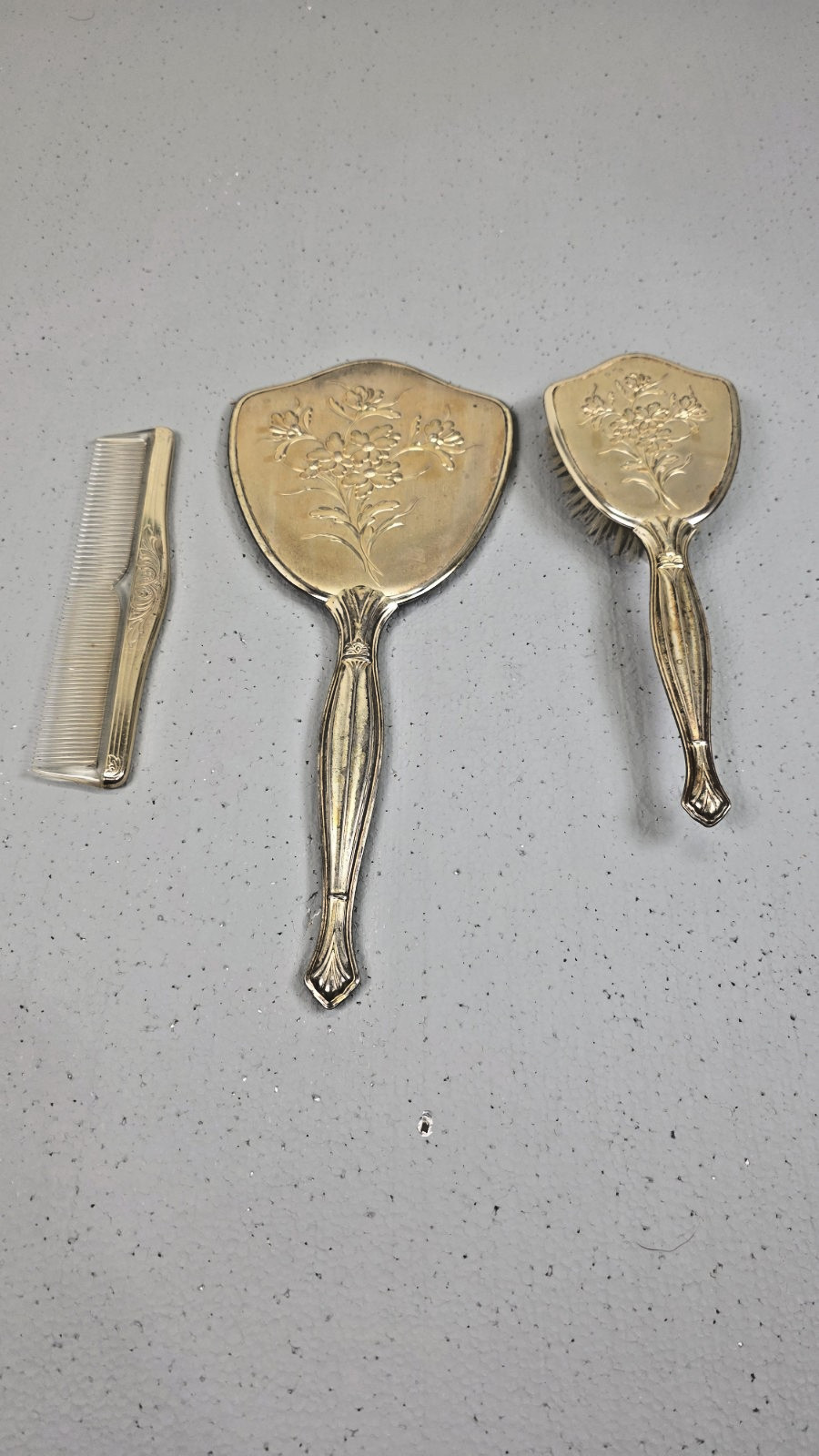 Vintage Art Deco Vanity Set Hand Mirror Comb & Hairbrush with Embossed Floral Vintage Art Deco Vanity Set Hand Mirror Comb & Hairbrush with Embossed Floral